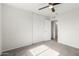 Bedroom featuring plush carpet, with sliding door closet and ceiling fan at 9033 N 15Th Dr, Phoenix, AZ 85021