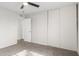 Bedroom with plush carpet, sliding door closet, and ceiling fan at 9033 N 15Th Dr, Phoenix, AZ 85021