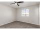 Clean bedroom features neutral walls, plush carpeting, and a bright window at 9033 N 15Th Dr, Phoenix, AZ 85021