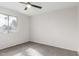 Bright bedroom with neutral walls, plush carpeting, and a bright window at 9033 N 15Th Dr, Phoenix, AZ 85021