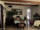 Bright dining room featuring wood beam ceilings and an archway at 9033 N 15Th Dr, Phoenix, AZ 85021