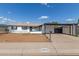 Charming single-story home with carport and white exterior at 9033 N 15Th Dr, Phoenix, AZ 85021