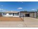 Charming single-story home with carport and white exterior at 9033 N 15Th Dr, Phoenix, AZ 85021