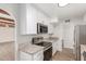 Bright kitchen with granite countertops, stainless appliances, and white cabinets at 9033 N 15Th Dr, Phoenix, AZ 85021