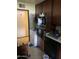 Outdated kitchen with older appliances and dark cabinetry at 9033 N 15Th Dr, Phoenix, AZ 85021