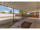 Covered patio overlooking a fenced backyard, ideal for relaxation and outdoor entertainment at 9033 N 15Th Dr, Phoenix, AZ 85021
