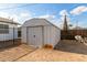 Backyard shed with door, providing storage space with a fenced yard and outdoor access at 9033 N 15Th Dr, Phoenix, AZ 85021