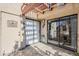 Balcony with sliding doors, a metal pergola, and access to the front door at 9275 E Mission Ln # 206, Scottsdale, AZ 85258