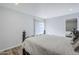 Bedroom showcases wood-look laminate flooring, neutral paint, recessed lights, and bed frame at 9275 E Mission Ln # 206, Scottsdale, AZ 85258