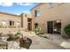 Exterior landscape showcasing a serene water feature, desert plants, and stone walkway at 9280 E Thompson Peak Pkwy # 25, Scottsdale, AZ 85255