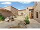 Landscaped courtyard with stone waterfall feature and desert landscaping at 9280 E Thompson Peak Pkwy # 25, Scottsdale, AZ 85255