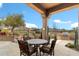 Covered patio with stone flooring, offering outdoor dining space and mountain views and a built in bbq at 9280 E Thompson Peak Pkwy # 25, Scottsdale, AZ 85255