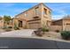 Beautiful two story home with a driveway lined with native desert plants and succulents at 9280 E Thompson Peak Pkwy # 25, Scottsdale, AZ 85255