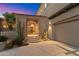 A charming front entrance welcomes you with native desert plants and stone walkway at 9280 E Thompson Peak Pkwy # 25, Scottsdale, AZ 85255