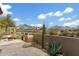 Enjoy outdoor cooking with a built-in grill on the patio, set against a backdrop of desert landscaping and mountains at 9280 E Thompson Peak Pkwy # 25, Scottsdale, AZ 85255