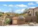 Built-in outdoor grill area, perfect for entertaining with desert landscaping and mountain views at 9280 E Thompson Peak Pkwy # 25, Scottsdale, AZ 85255