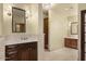 Elegant bathroom vanity with marble countertops, bright lighting, and ample storage cabinets at 9331 E La Posada Ct, Scottsdale, AZ 85255