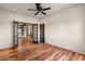 Bedroom with wood floors and bright lighting with a spacious doorway at 9331 E La Posada Ct, Scottsdale, AZ 85255