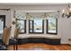 Charming dining area with a built-in window seat, custom drapes, and great natural lighting at 9331 E La Posada Ct, Scottsdale, AZ 85255