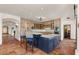 Well-lit kitchen boasting a center island with seating, custom cabinetry, and open access to other living spaces at 9331 E La Posada Ct, Scottsdale, AZ 85255