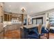 Spacious kitchen featuring custom cabinets, granite countertops, a center island, and stainless steel appliances at 9331 E La Posada Ct, Scottsdale, AZ 85255