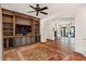 Inviting living room showcasing custom built-ins, tile floors, and an open layout at 9331 E La Posada Ct, Scottsdale, AZ 85255