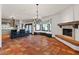 Open-concept living space with a kitchen, fireplace, window seating, and great natural light throughout at 9331 E La Posada Ct, Scottsdale, AZ 85255