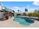 Luxury home featuring a private pool, lush landscaping, and a unique architectural design at 9331 E La Posada Ct, Scottsdale, AZ 85255