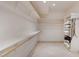 Spacious walk-in closet featuring built-in shelves and ample storage space for clothes and accessories at 9331 E La Posada Ct, Scottsdale, AZ 85255