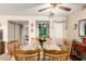 Well-lit dining room showcases a wooden table and chairs, complemented by a ceiling fan and neutral decor at 9345 N 92Nd St # 201, Scottsdale, AZ 85258