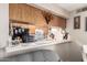 Functional kitchen bar featuring ample counter space and a view of modern appliances and cabinet storage at 9345 N 92Nd St # 201, Scottsdale, AZ 85258