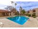 Inviting community swimming pool, with ample seating and mature landscaping enhancing the pool's surrounding at 9345 N 92Nd St # 201, Scottsdale, AZ 85258