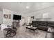 Spacious living room features wood floors, bright white walls, and stylish furniture at 9539 W Agora Ln, Tolleson, AZ 85353