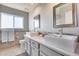 Contemporary bathroom featuring dual sinks, quartz countertop, and mosaic backsplash at 9921 E Doubletree Ranch Rd, Scottsdale, AZ 85258