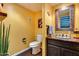 Cozy half bath with custom sink and mirror at 9921 E Doubletree Ranch Rd, Scottsdale, AZ 85258