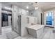 This primary bathroom includes a walk-in shower, stand alone tub, and luxury finishes at 9921 E Doubletree Ranch Rd, Scottsdale, AZ 85258