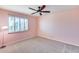 This bedroom is simple and features a window with plantation shutters at 9921 E Doubletree Ranch Rd, Scottsdale, AZ 85258