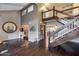 Grand foyer with hardwood floors, a staircase, and ample natural light at 9921 E Doubletree Ranch Rd, Scottsdale, AZ 85258