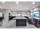 Modern kitchen with two-tone cabinets, granite counters, large island, and stainless steel appliances at 9921 E Doubletree Ranch Rd, Scottsdale, AZ 85258