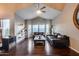 Inviting living room featuring vaulted ceilings, hardwood floors, black leather sofas, and large windows at 9921 E Doubletree Ranch Rd, Scottsdale, AZ 85258