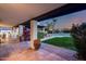 Covered patio with tiled floor overlooking the pool and landscaped backyard at 9921 E Doubletree Ranch Rd, Scottsdale, AZ 85258