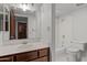 Bathroom featuring modern fixtures, wood cabinets, a large mirror, and a bathtub at 100 N Lazy Fox Rd # 3, Wickenburg, AZ 85390