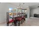 Bright dining room featuring a stylish chandelier and large windows with picturesque outdoor views at 100 N Lazy Fox Rd # 3, Wickenburg, AZ 85390