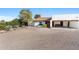 Charming single-story home with a well-kept front yard and a two-car carport at 100 N Lazy Fox Rd # 3, Wickenburg, AZ 85390