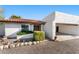 Charming single-story home with a red-tile roof, inviting entrance, and a two-car carport at 100 N Lazy Fox Rd # 3, Wickenburg, AZ 85390