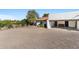 Street view of a beautiful home with a private drive and attached carport at 100 N Lazy Fox Rd # 3, Wickenburg, AZ 85390