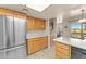 Open kitchen with stainless steel appliances, ample counter space, and breakfast bar seating at 100 N Lazy Fox Rd # 3, Wickenburg, AZ 85390