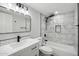 Modern bathroom featuring marble tile, black fixtures, and updated vanity and hexagon tile accents at 10252 N 46Th Dr, Glendale, AZ 85302