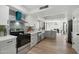 Bright, updated kitchen boasts stainless steel appliances, gray cabinets, and a view into the dining area at 10252 N 46Th Dr, Glendale, AZ 85302