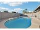 Inviting pool with tile trim surrounded by gravel, offering a private backyard oasis at 10252 N 46Th Dr, Glendale, AZ 85302